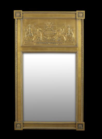 Appraisal: Empire-Style Giltwood Looking Glass the frame with projecting floral block-carved