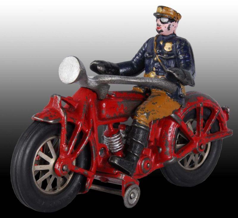 Appraisal: Cast Iron Globe Motorcycle Toy Description Scarce Demountable policeman rider