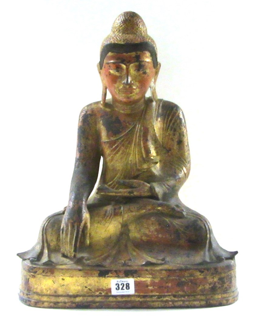 Appraisal: A gilt-lacquered bronze figure of Buddha seated in dhyanasana with