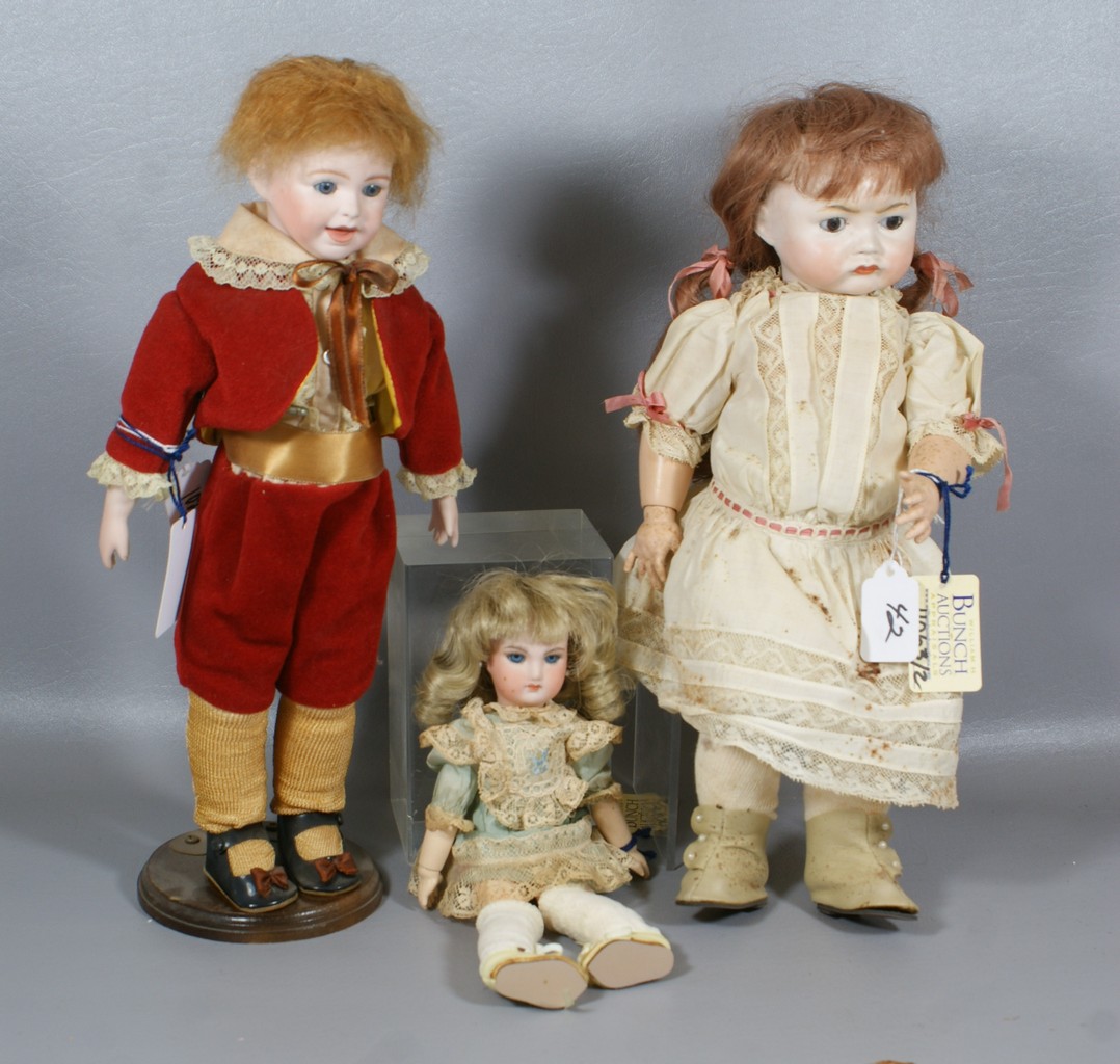 Appraisal: Reproduction French Bisque Dolls larger a replica of SFBJ and