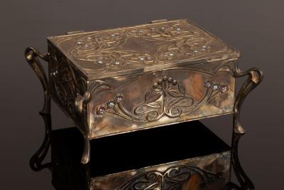 Appraisal: An Art Nouveau style metal jewellery box with sinuous foliate