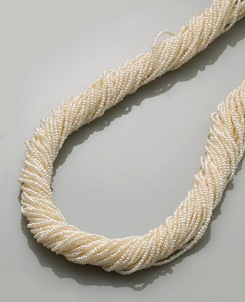 Appraisal: Seed Pearl Torsade Necklace Thirty-two strands of mm white seed