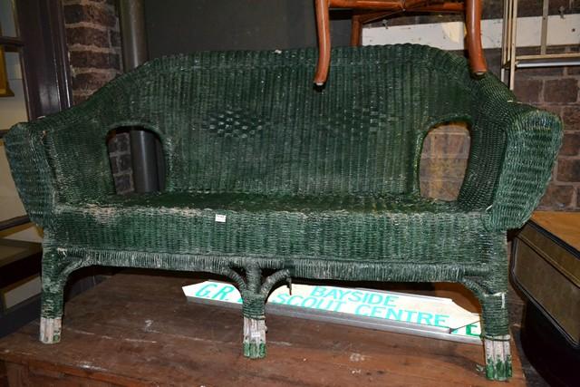 Appraisal: A GREEN PAINTED OUTDOOR TWO SEATER CANE LOUNGE A GREEN