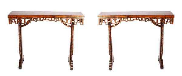 Appraisal: A pair of Chinese hardwood open work alter tables height