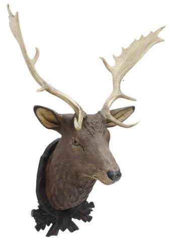 Appraisal: Black Forest carved wood stag's head trophy mount with natural