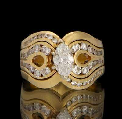 Appraisal: A Ladies' Marquis Cut Diamond Ring with Guard k yellow