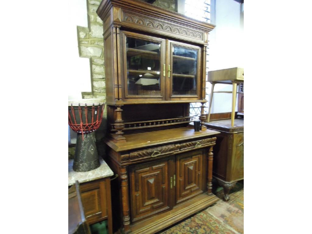 Appraisal: A French oak buffet the upper section with stepped and