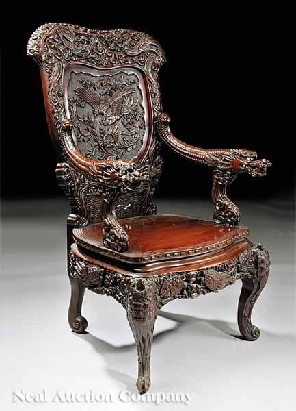 Appraisal: A Highly Carved Southeast Asian Hardwood Throne Chair late th