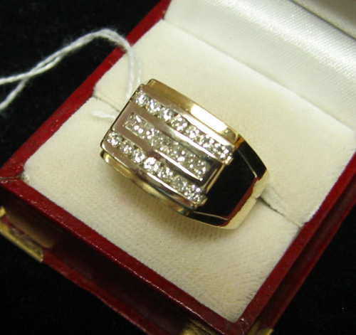 Appraisal: MAN'S DIAMOND AND FOURTEEN KARAT GOLD RING set with two