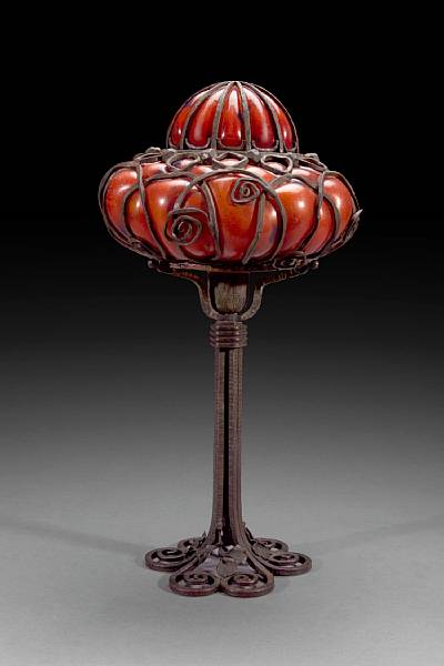 Appraisal: A French Art Deco wrought iron and mottled glass lamp