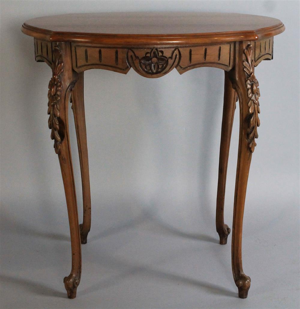 Appraisal: LOUIS XV STYLE OVAL FRUITWOOD SIDE TABLE with carved conforming