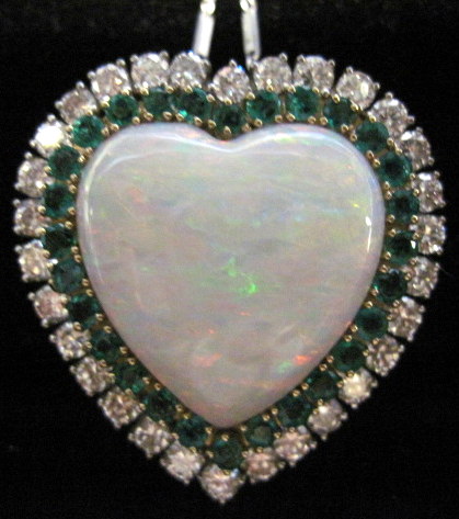 Appraisal: karat white and yellow gold opal emerald and diamond heart