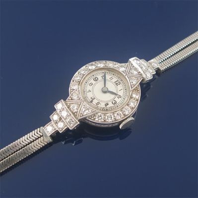 Appraisal: A diamond set cocktail watch the circular dial to a