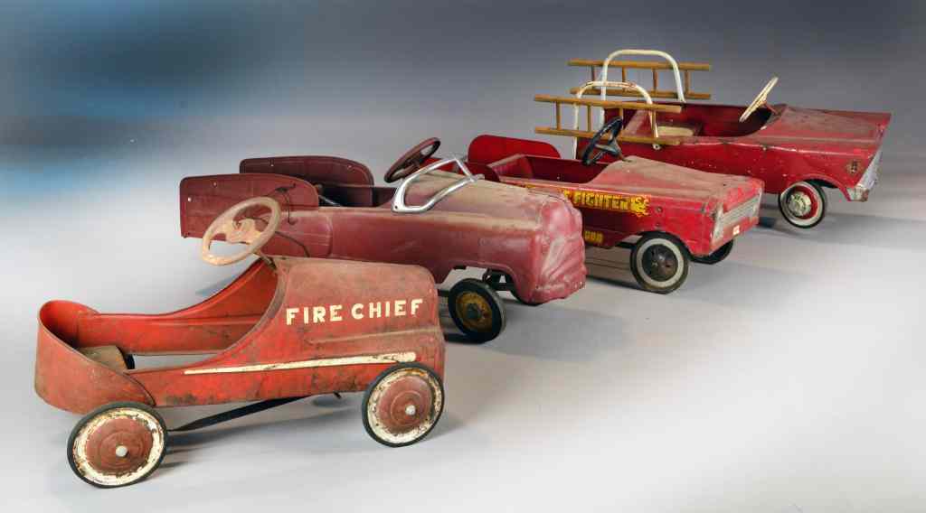 Appraisal: Antique Fire Pedal Car TrucksTo include a Fire Chief a