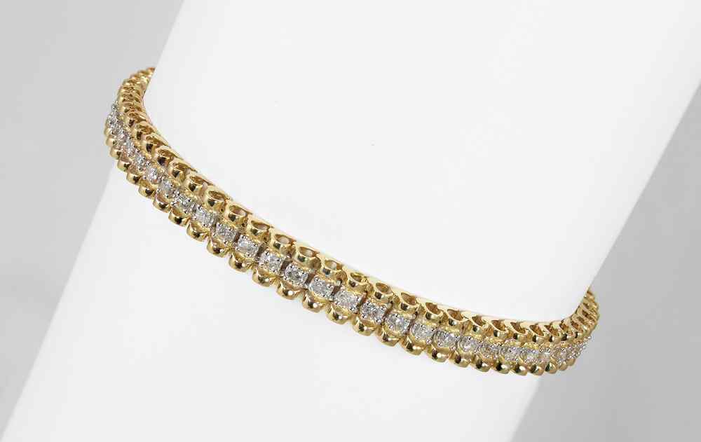 Appraisal: K CTW DIAMOND LINE BRACELET K yellow gold bracelet contains