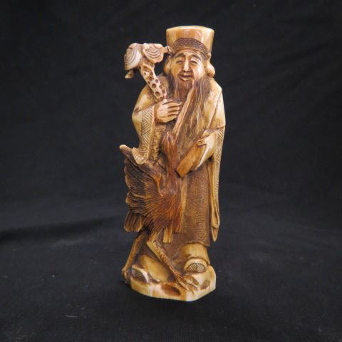 Appraisal: Chinese Carved Ivory Figurine of an Old Manwith bird excellent