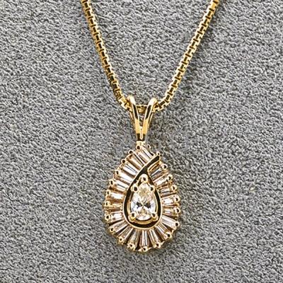 Appraisal: K GOLD PEAR-SHAPED DIAMOND CLUSTER PENDANT Pear-shaped diamond surrounded by