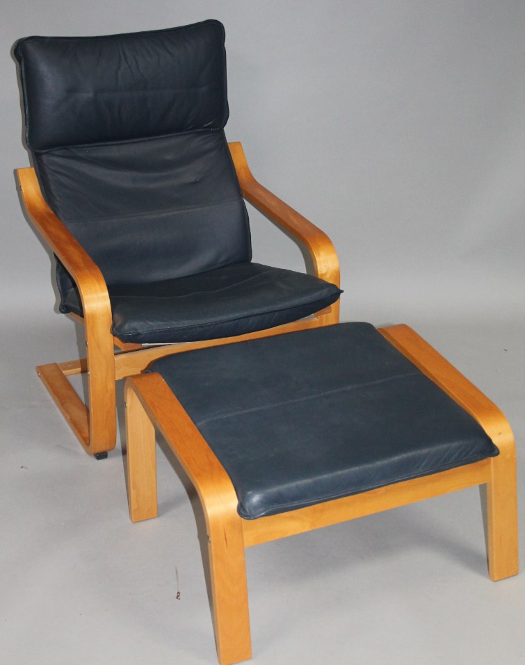 Appraisal: A modern beech framed cantilever armchair and footstool with blue