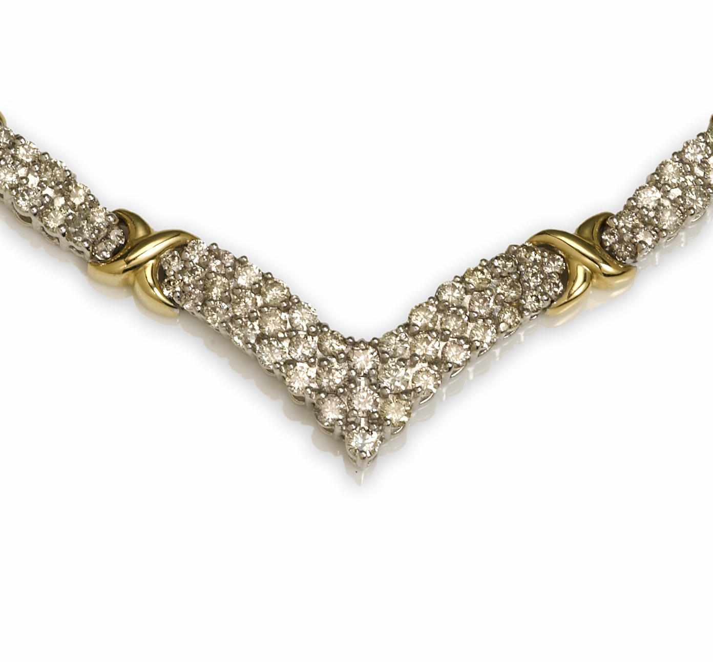 Appraisal: A diamond and fourteen karat bicolor gold ''x'' motif necklace