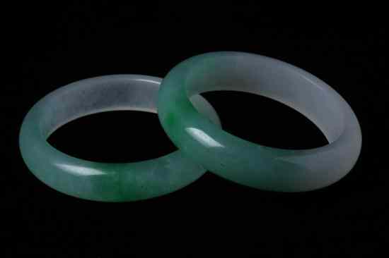 Appraisal: TWO CHINESE CELADON AND APPLE GREEN JADEITE BANGLES - Inside