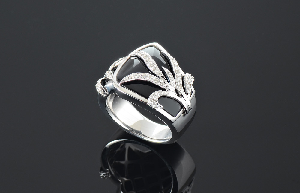 Appraisal: K BLACK ONYX AND DIAMOND RING A high style K