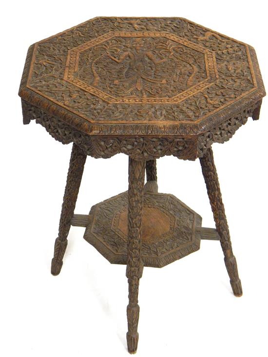 Appraisal: Middle Eastern carved stand octagonal top with three-headed deity holding