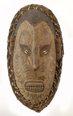 Appraisal: A Sepik River mask with inset cowrie shell eyes and