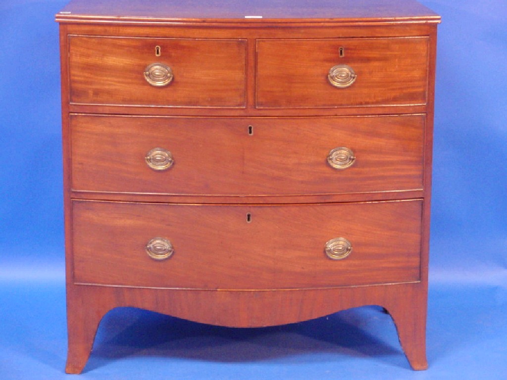 Appraisal: A George III figured mahogany bow fronted chest of two