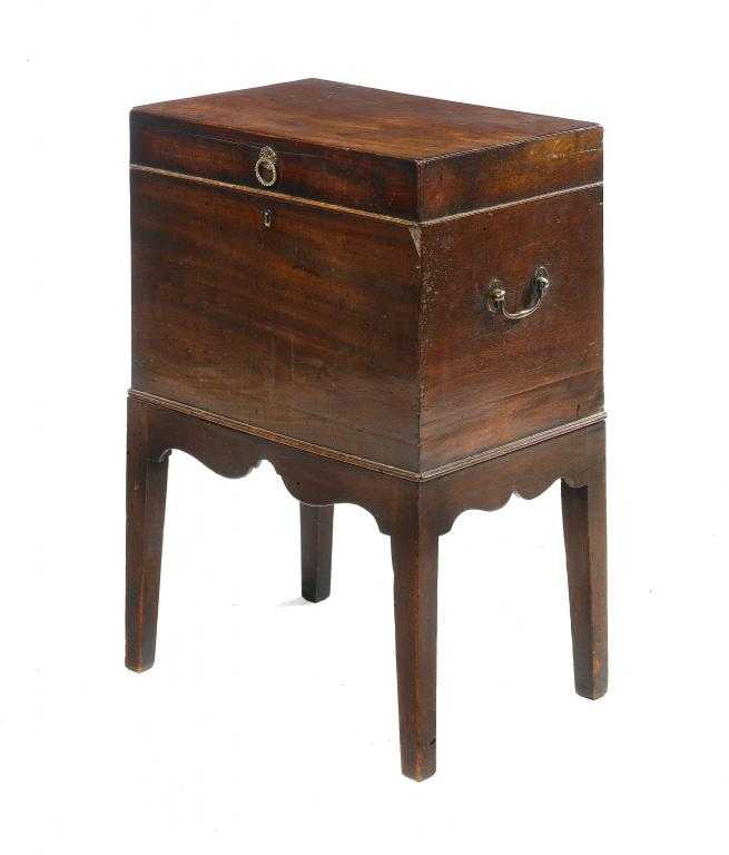 Appraisal: A GEORGE III MAHOGANY CELLARET the lid with brass beaded