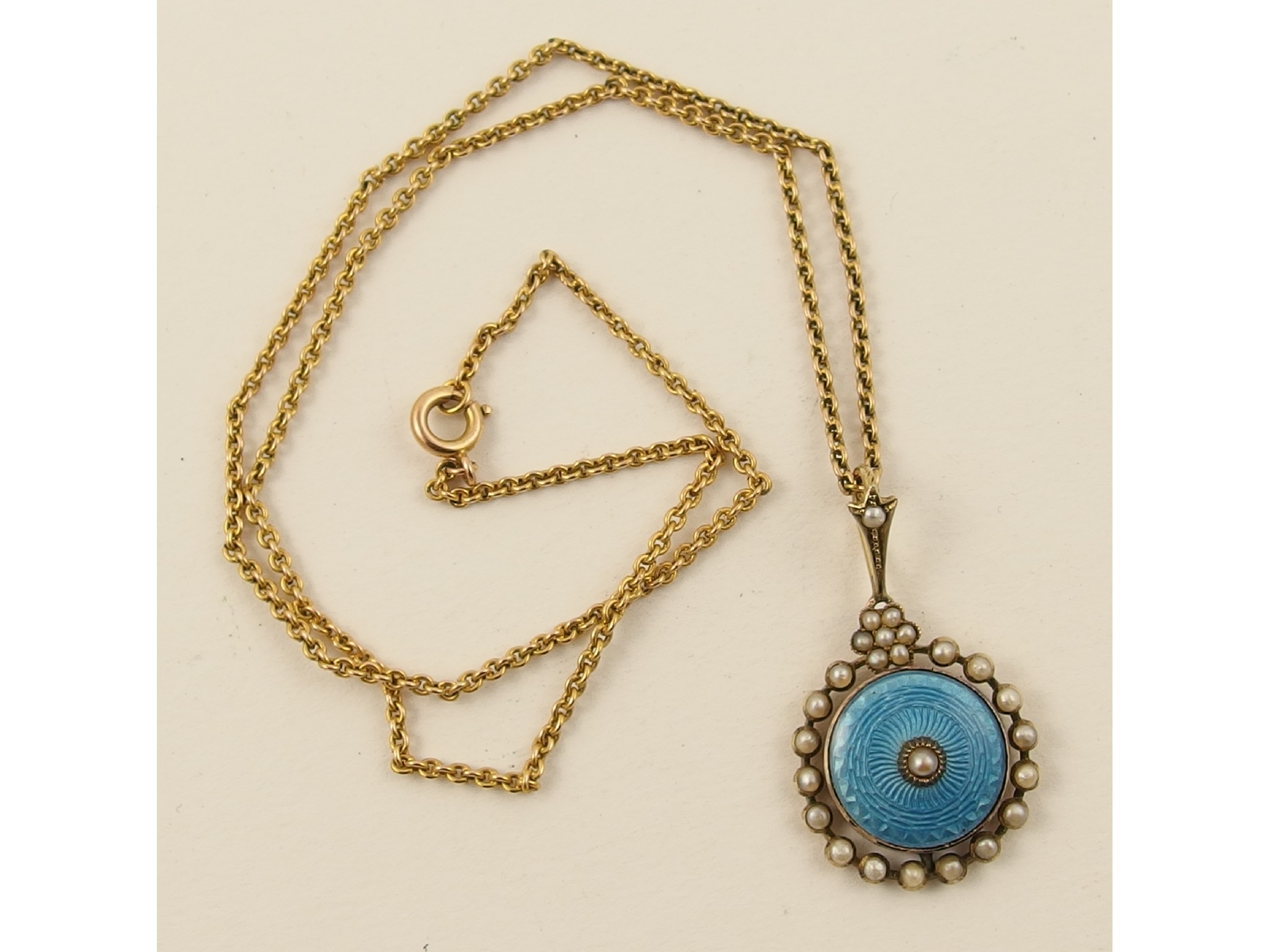 Appraisal: A yellow metal turquoise enamel and pearl set pendant on