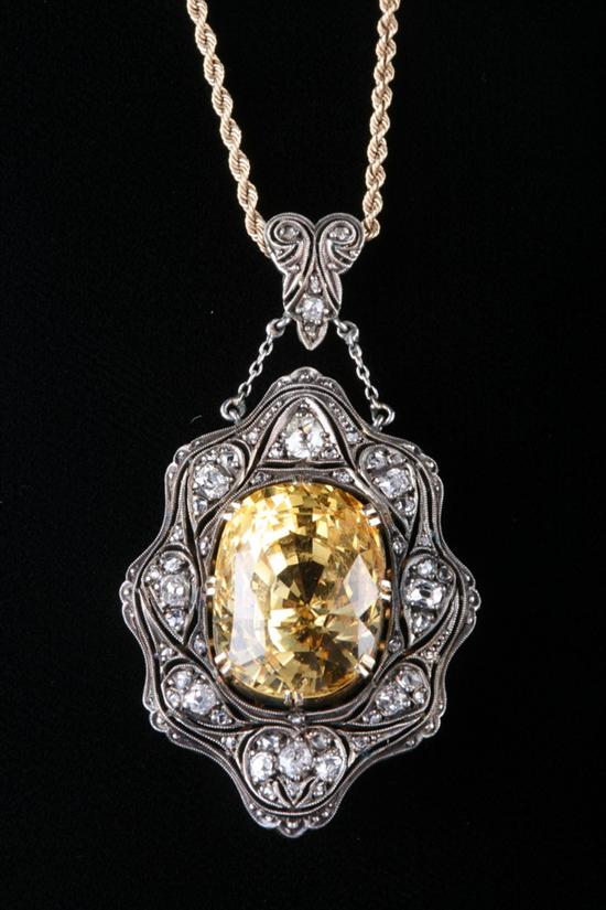 Appraisal: ANTIQUE YELLOW GOLD SILVER DIAMOND AND YELLOW SAPPHIRE PENDANT Oval