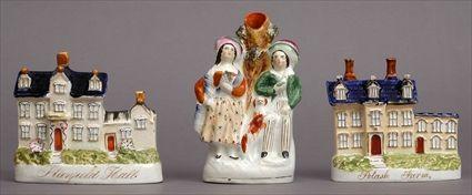 Appraisal: TWO SIMILAR STAFFORDSHIRE BUILDING MODELS AND A FIGURAL SPILL VASE