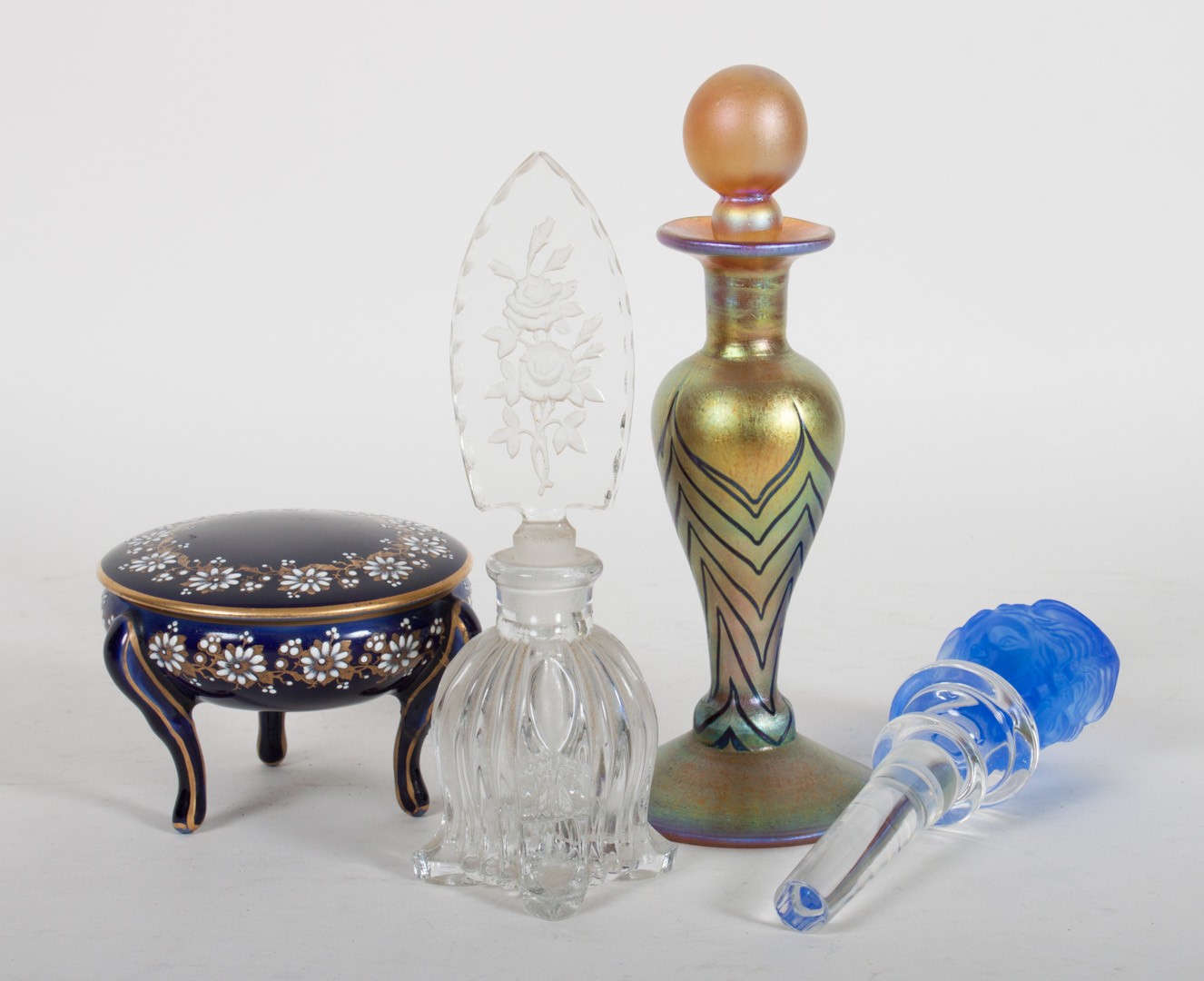 Appraisal: Four glass and porcelain articles comprising American iridescent glass scent