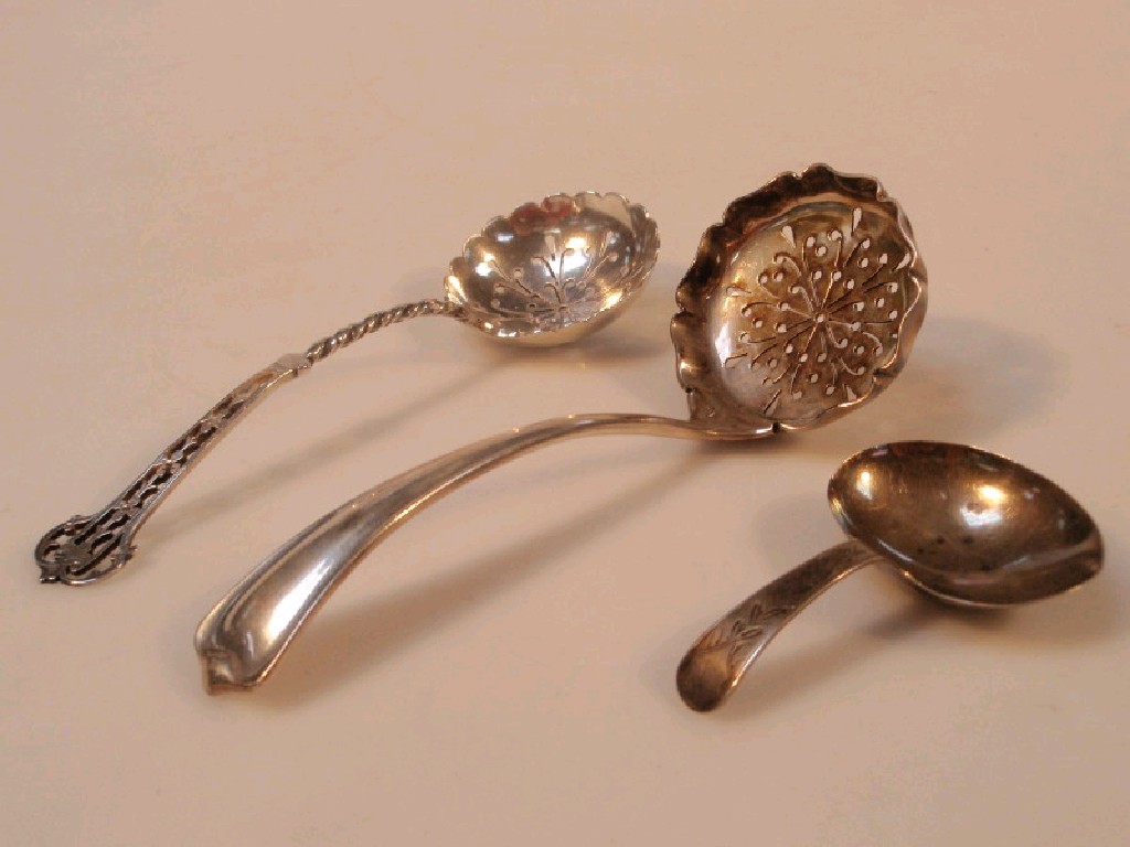 Appraisal: Two silver sifter spoons and a caddy spoon various marks