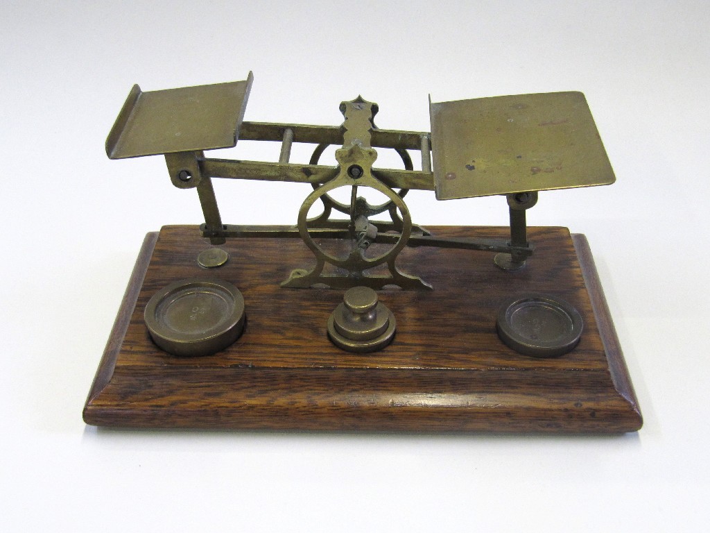 Appraisal: Set of brass postage scales with weights