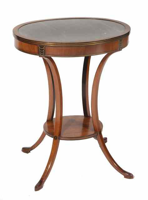 Appraisal: A FRENCH EMPIRE MAHOGANY OVAL TWO TIER OCCASIONAL TABLE with