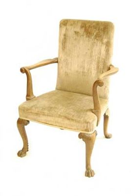 Appraisal: A George II walnut open armchair the padded back and