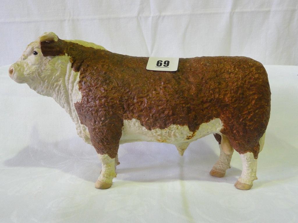 Appraisal: A matt glazed model of a standing Hereford Bull with