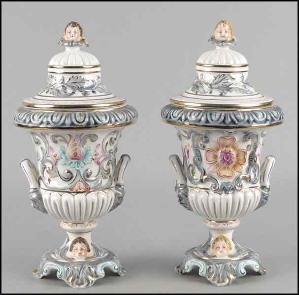 Appraisal: PAIR OF ITALIAN R CAPODIMONTE PORCELAIN COVERED URNS Height ''