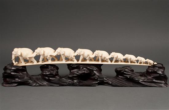 Appraisal: Chinese carved ivory elephant bridge on a carved ebonized wood