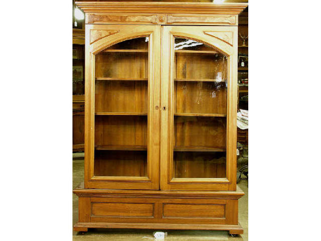 Appraisal: Beautiful - 's walnut double door book case featuring arched