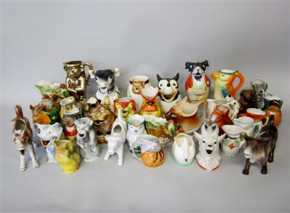 Appraisal: Large collection of bird fish animal form ceramic creamers Including