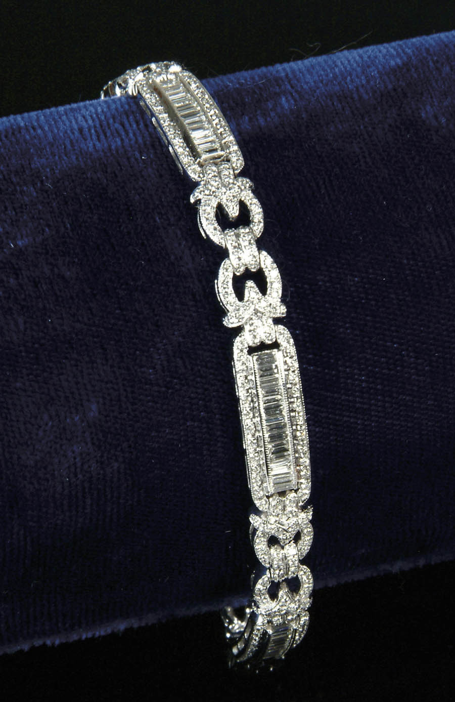 Appraisal: DIAMOND AND K WHITE GOLD BRACELET Fifty-eight straight diamond baguettes