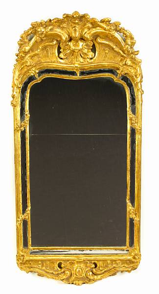 Appraisal: A Swedish Rococo giltwood mirror th century The arched shaped