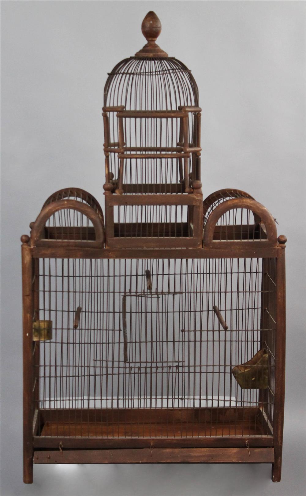 Appraisal: VINTAGE TRIPLE ARCHED WOOD AND WIRE BIRDCAGE finial topped dome