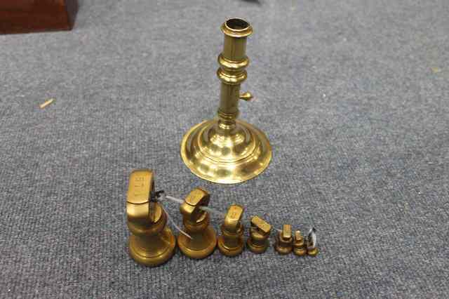 Appraisal: AN ANTIQUE BRASS CANDLESTICK with turned spreading base high together