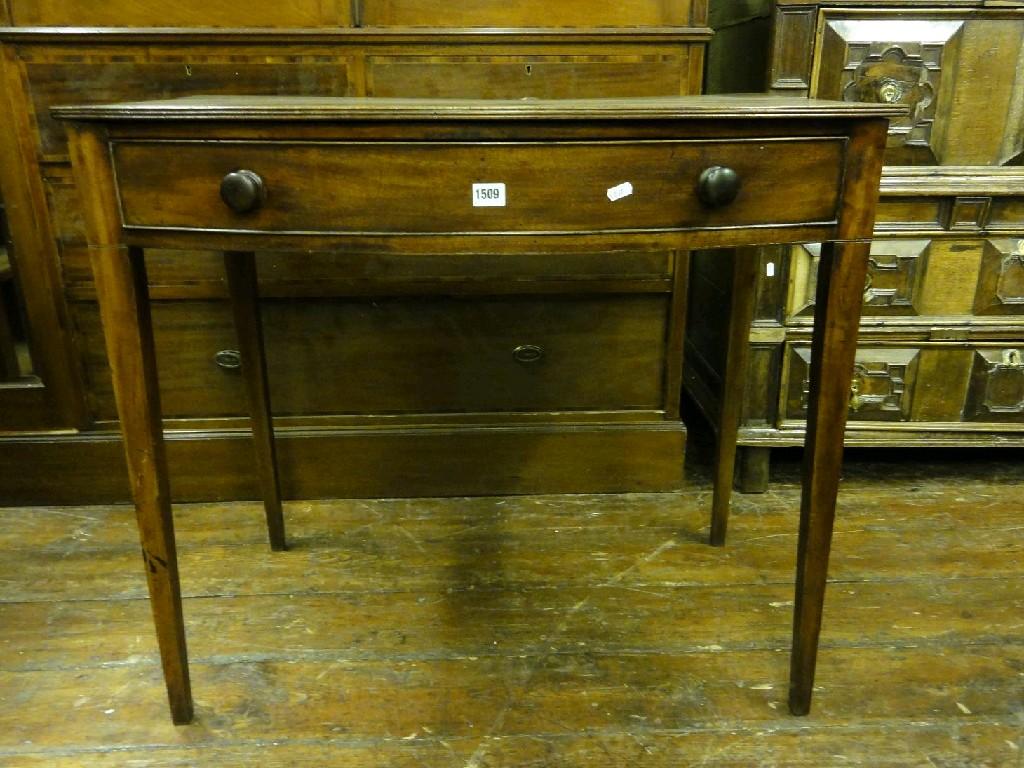 Appraisal: A th century mahogany bow front side table fitted with