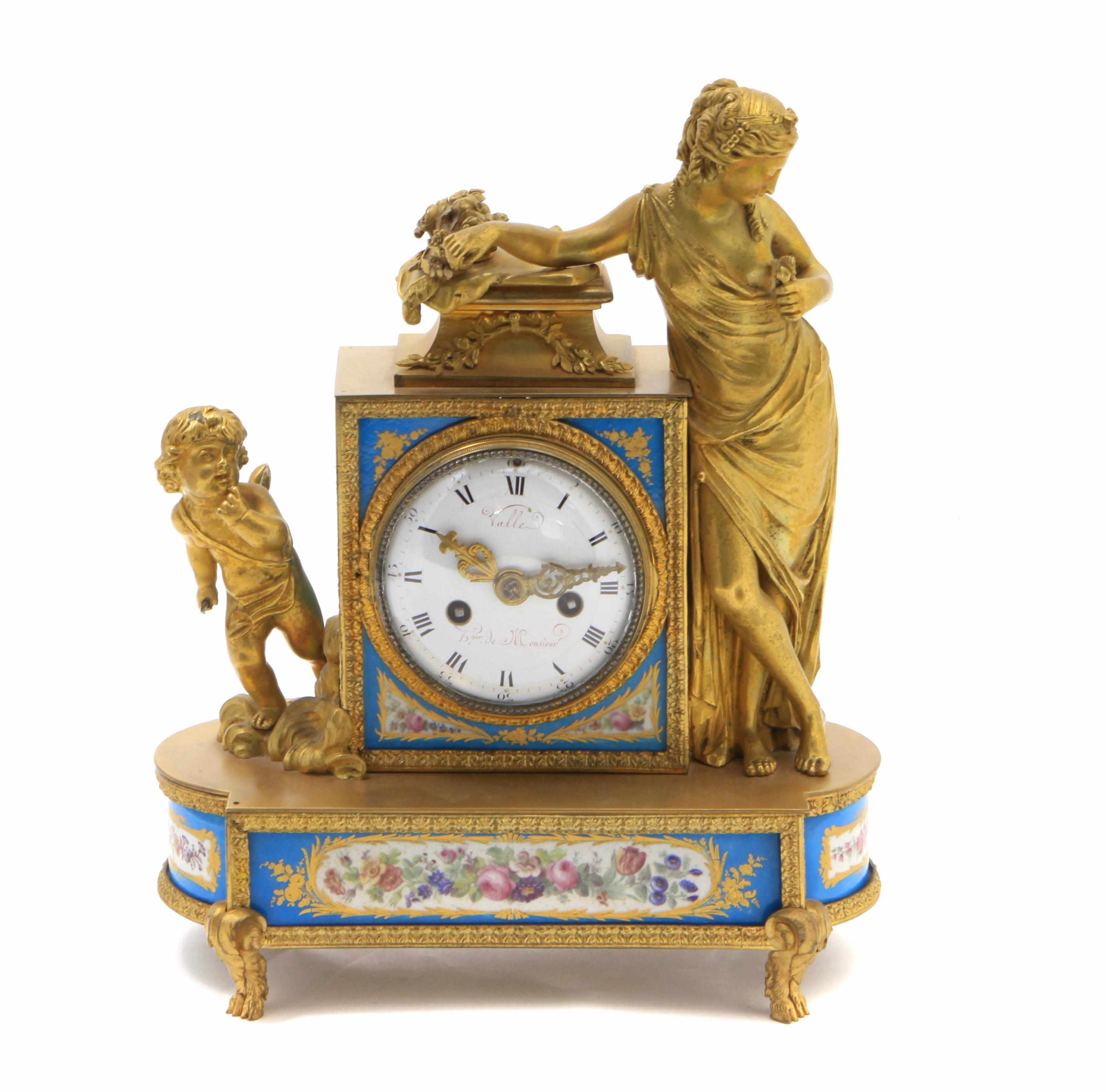 Appraisal: A Louis XVI style porcelain inset gilt bronze mantel clock