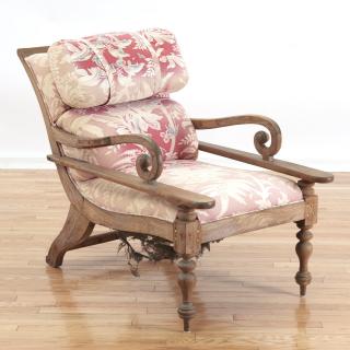 Appraisal: Anglo-Indian plantation chair th c turned legs red chintz upholstery