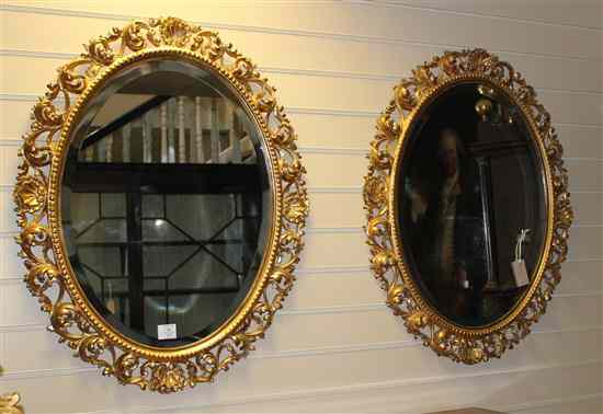 Appraisal: A pair of carved giltwood and gesso Florentine framed oval